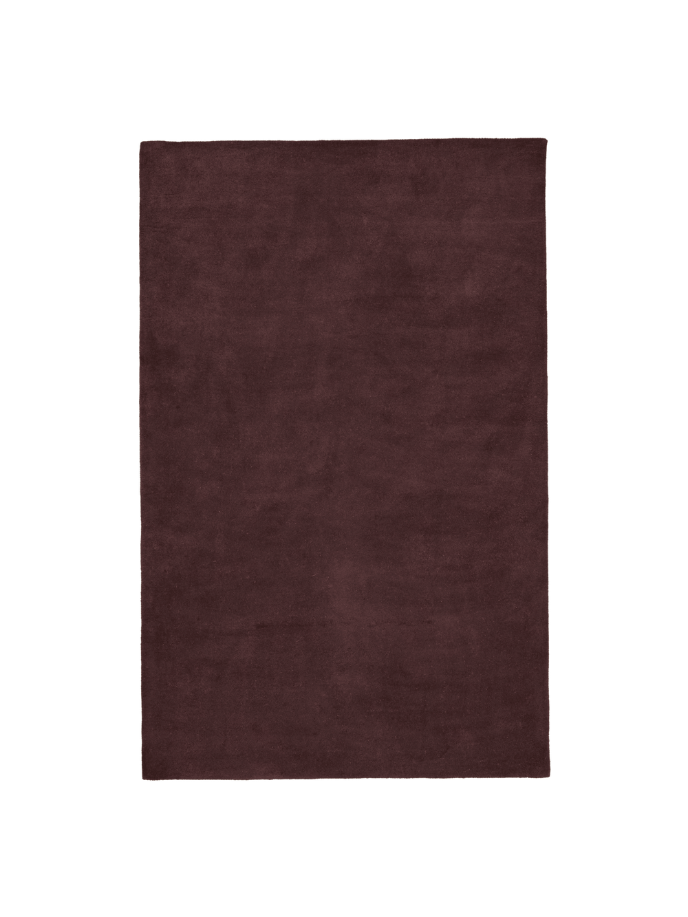 Rectangular tufted rug in dark pecan with dense pile, seen from above
