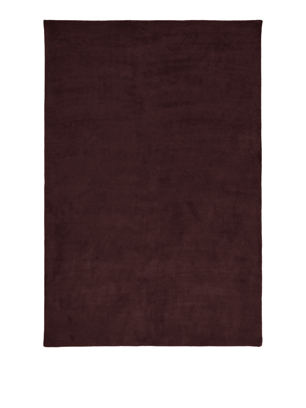 Rectangular tufted rug in dark pecan with dense pile, seen from above