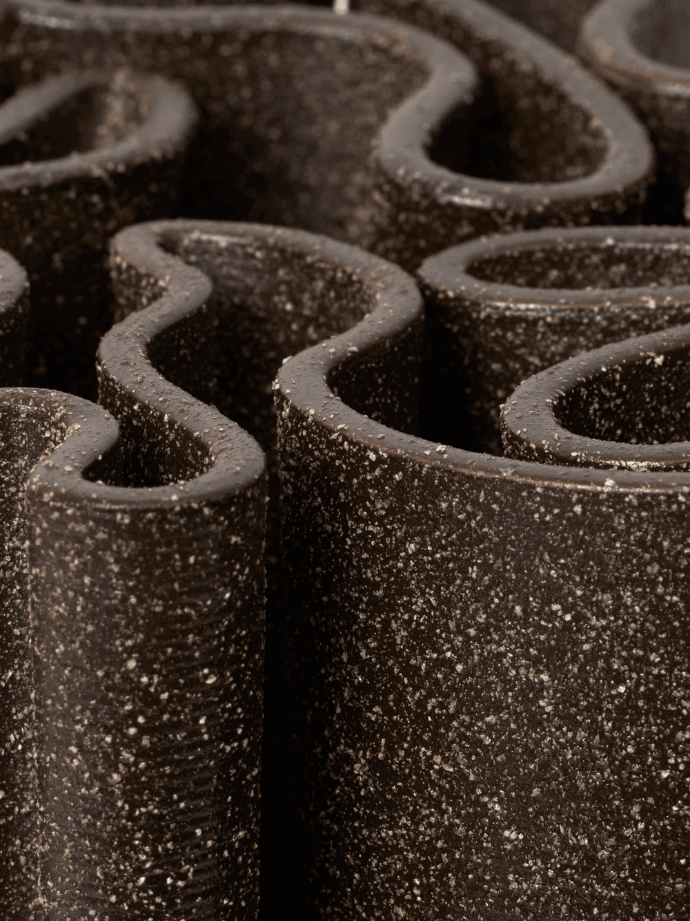 Close-up of the winding labyrinth top and speckled dark brown surface