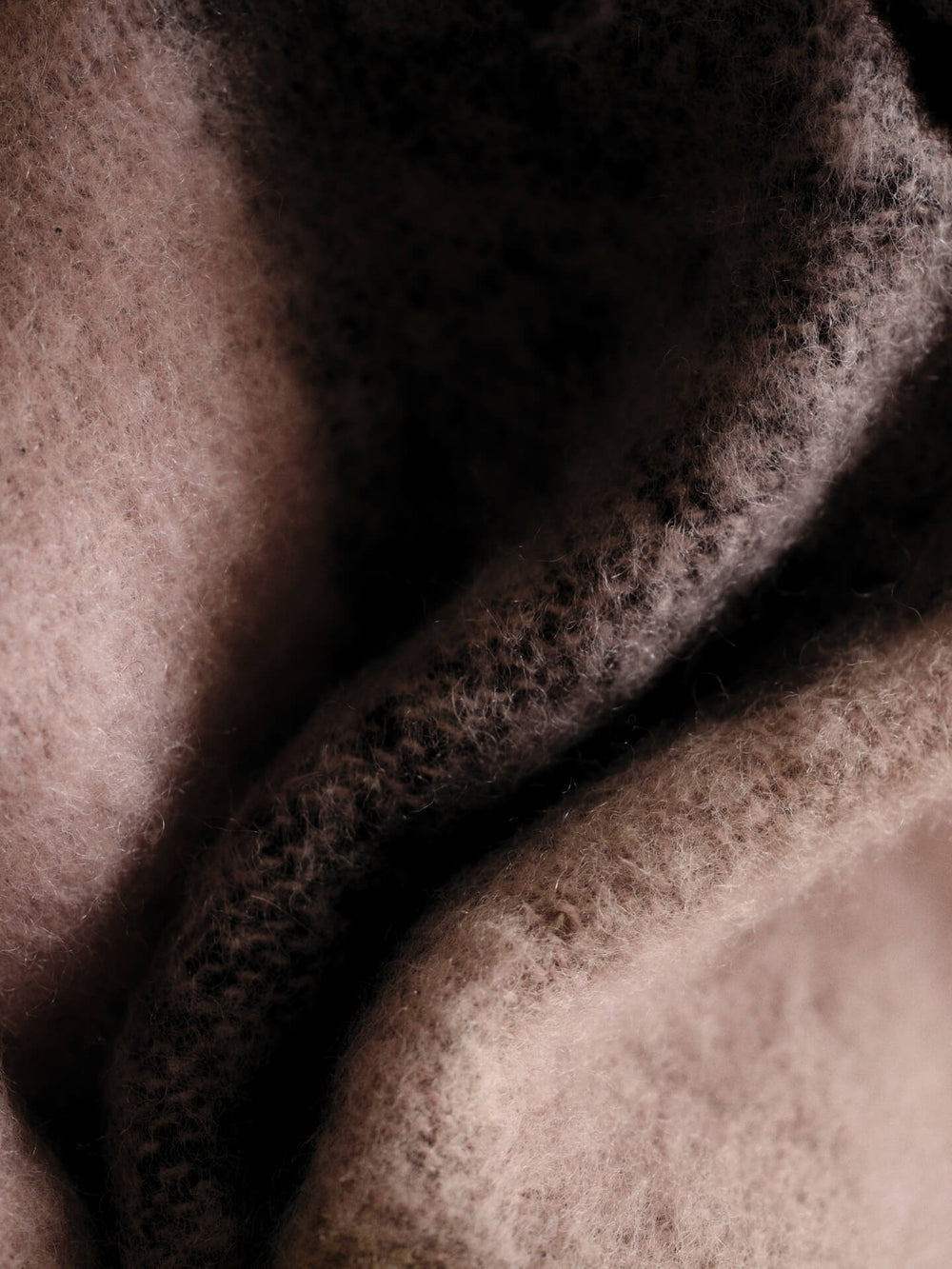 Close-up of the brushed surface, with checked colours blurring into each other