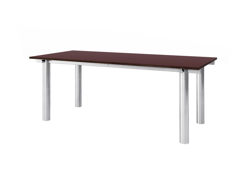 Rectangular dining table with burgundy linoleum top and cylindrical brushed steel legs, angled view