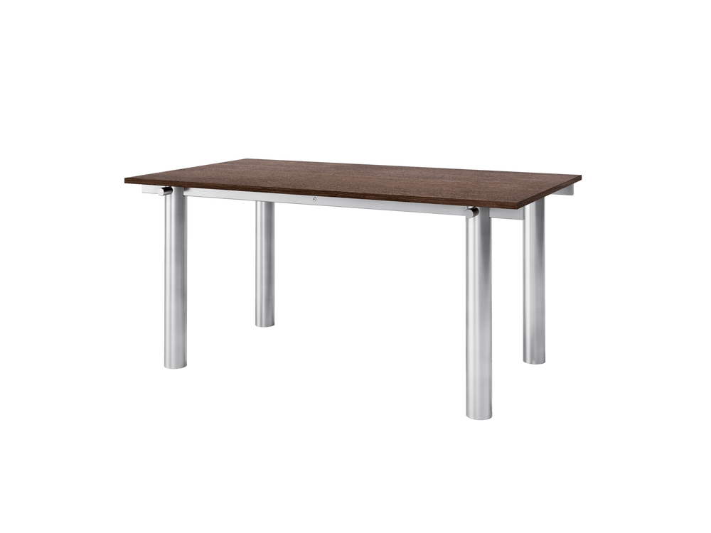 Dining table seen at an angle, dark stained oak top on a brushed stainless steel frame